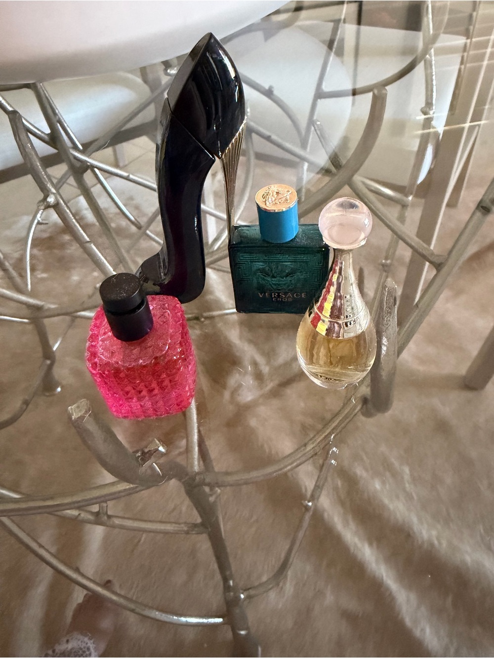 Fragrance Bottles on Glass Table